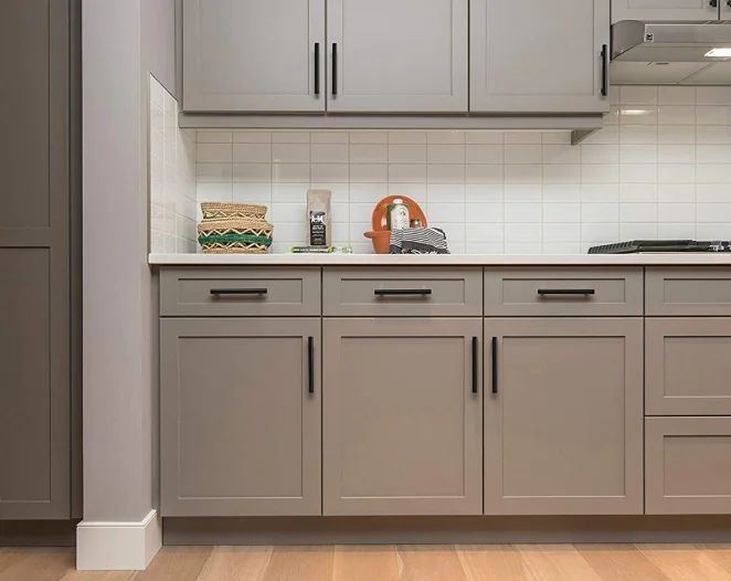 white kitchen with grey cabinetry and white countertop